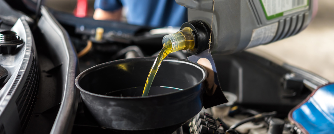 Engine oil being poured into a vehicle - Car Servicing Soham, Ely