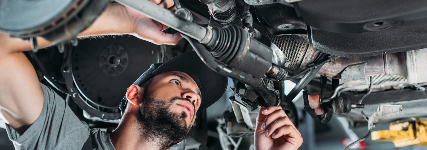 Mechanic looking underneath a vehicle - Car Repairs Soham, Ely